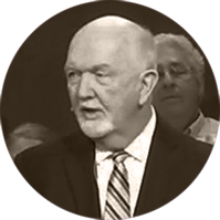 Dr. Tim Marrow speaking at a podium